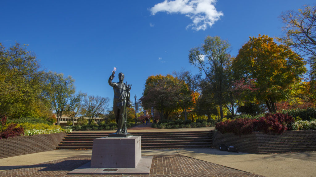 The torch bearer surrounded by Circle Park on a sunny, fall day.