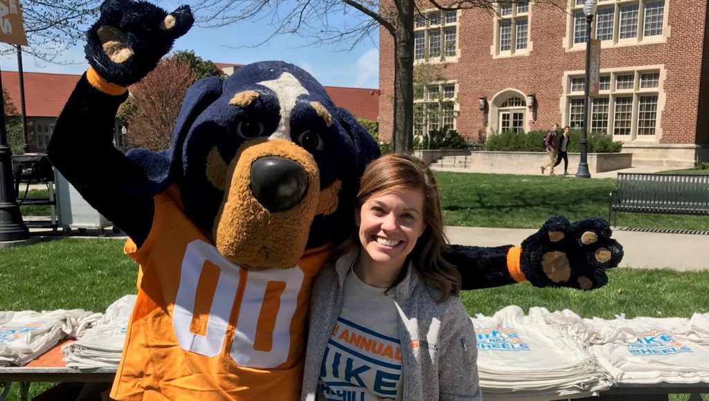 Smokey and Michelle Buck posing for a picture at Hike the Hill in Heels event on campus